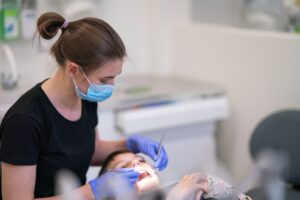 a-young-female-orthodontist-examines-the-boy-s-tee-2025-01-08-14-29-41-utc
