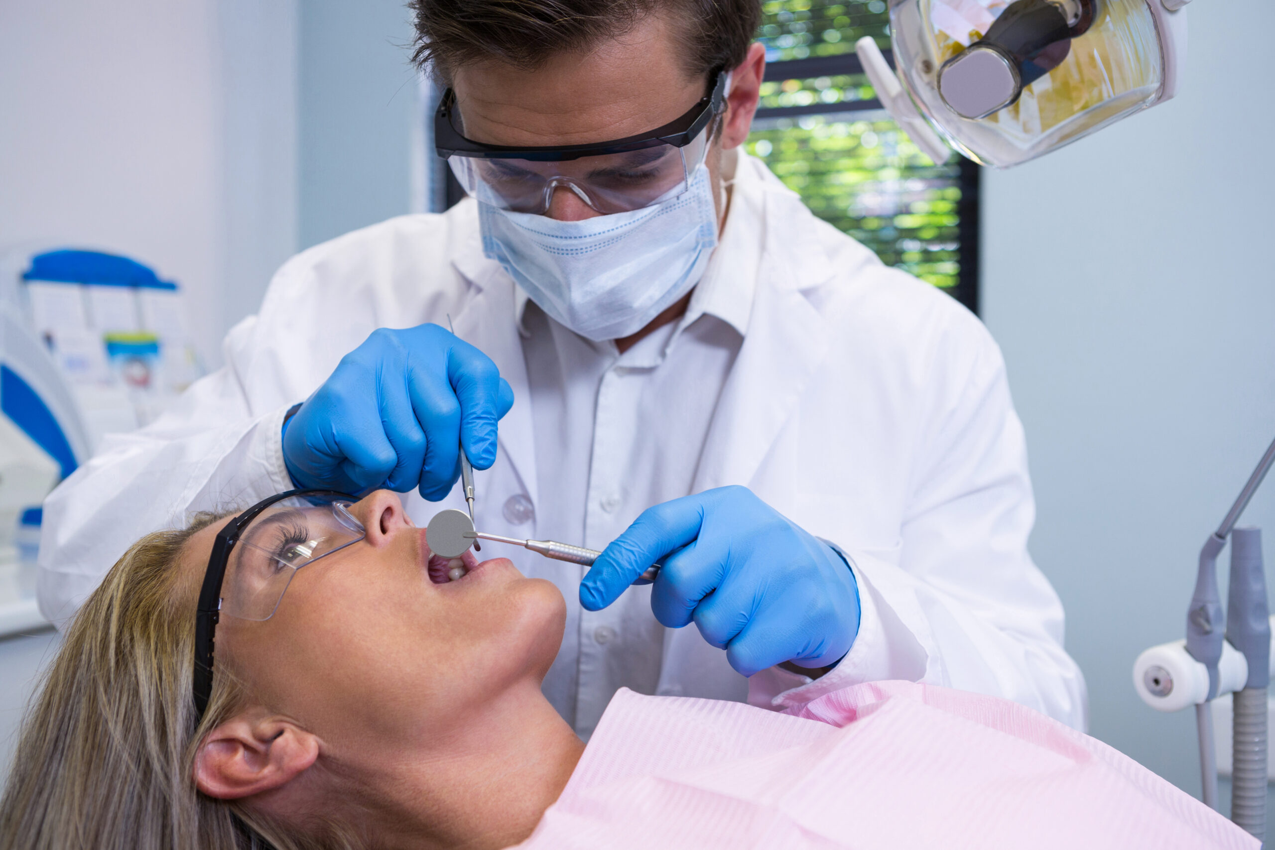 close-up-of-dentist-examining-woman-2025-04-04-11-24-32-utc