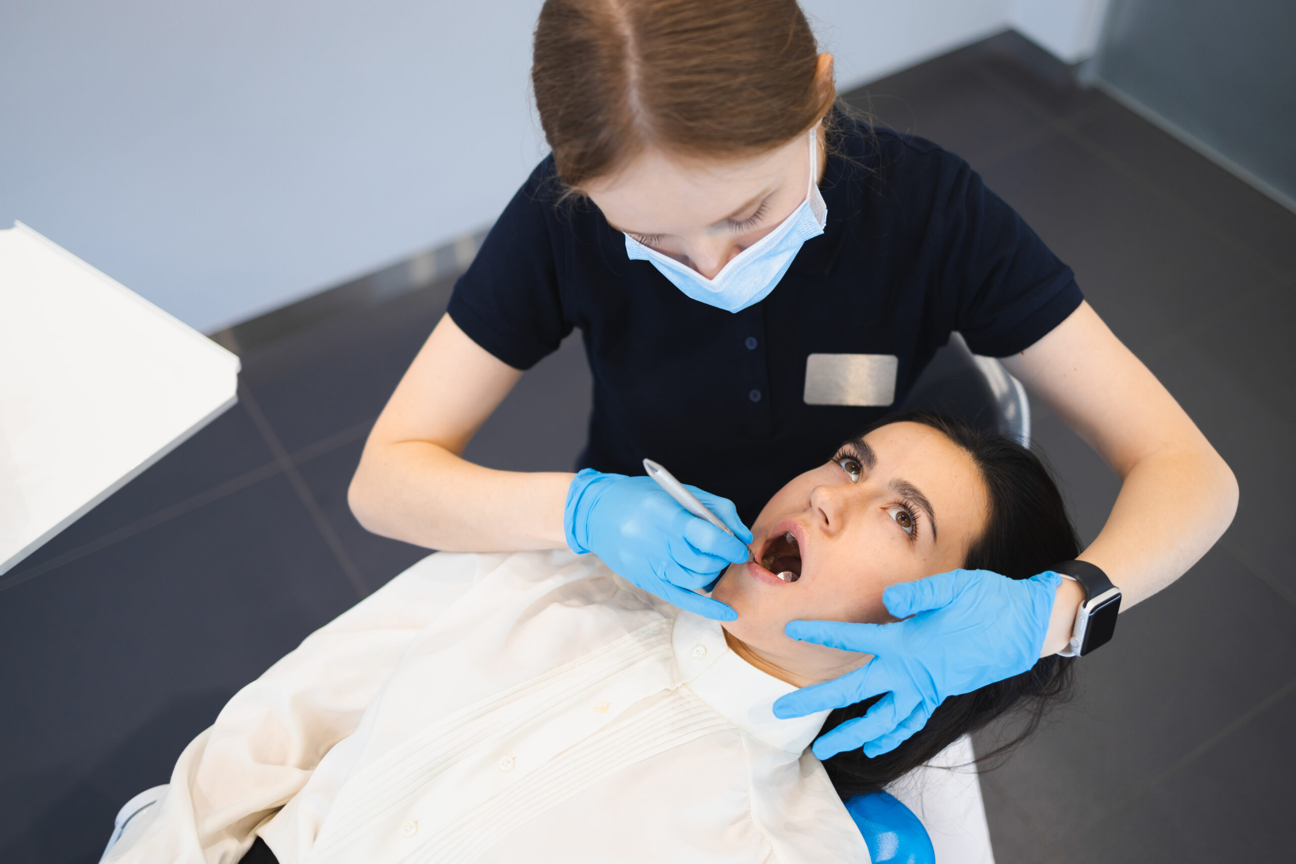 Young woman on dentist appointment. Prevention of dental problems